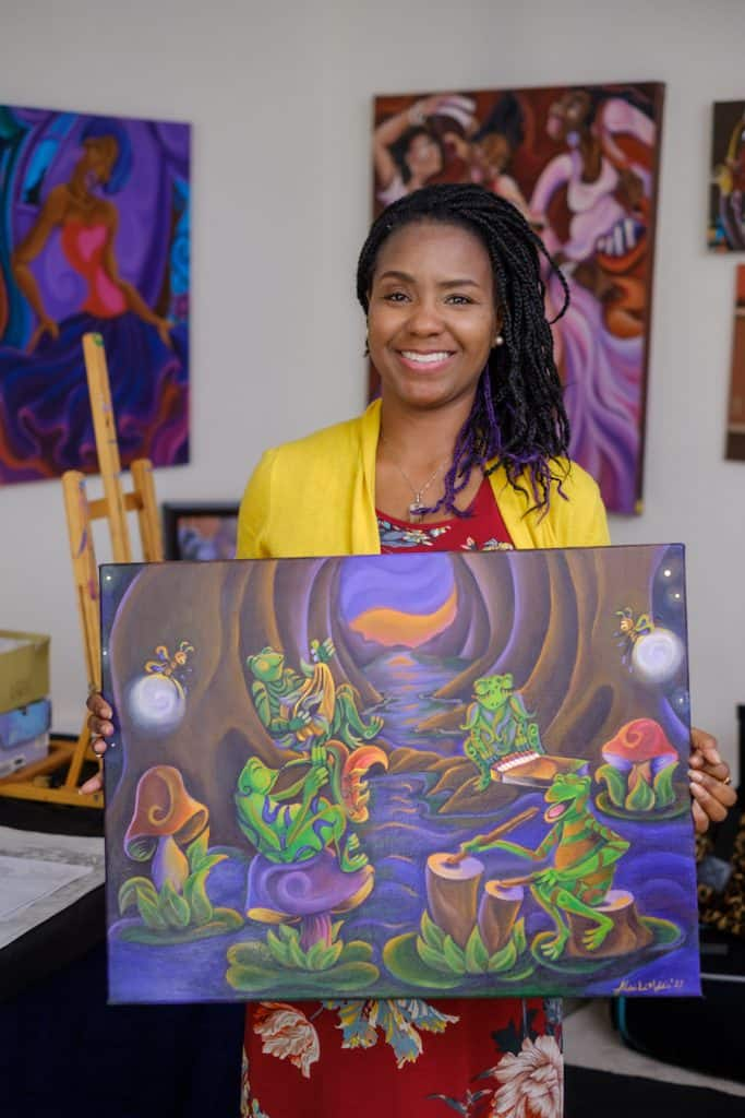 Sharika Mahdi holds painting