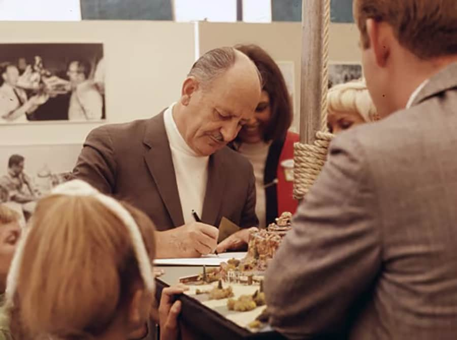 Disney leaders signing autographs