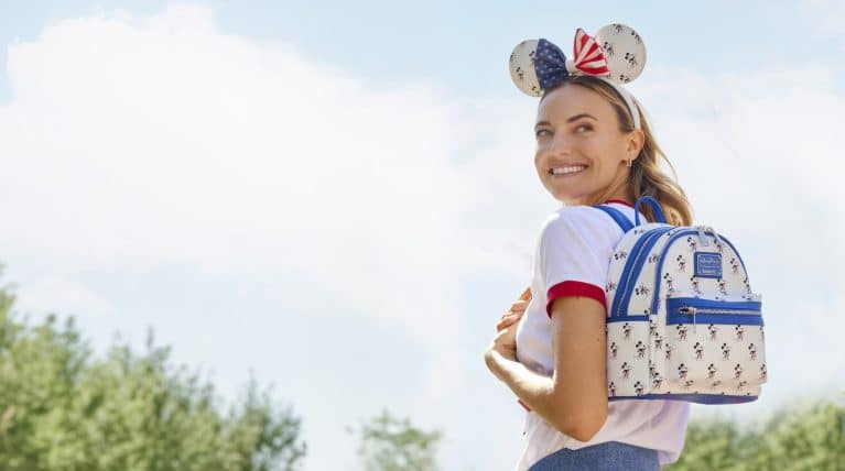 Disney Fourth of July Merchandise: The Disney Americana Collection includes a Loungefly Mini Backpack and Ear Headband along with a variety of tees.
