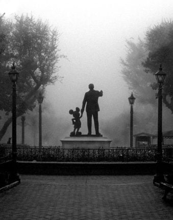 The Partners Statue at Disneyland on a foggy morning