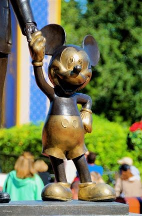 Zoomed-in photo of Mickey as part of the Partners Statue