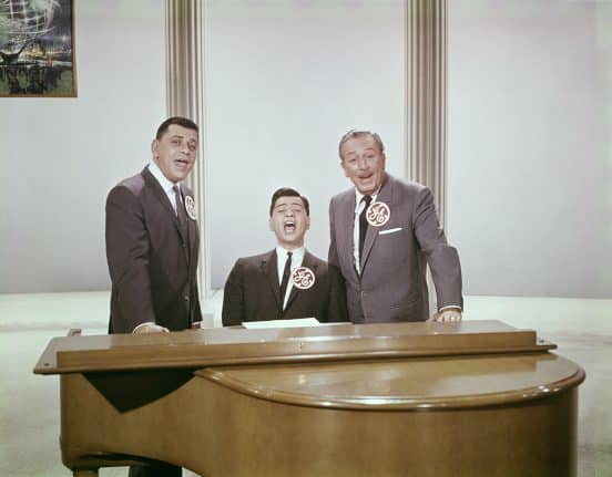 Walt Disney signing with the Sherman Brothers