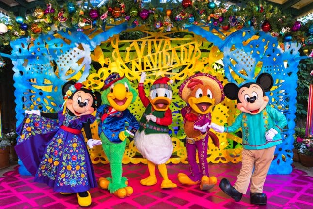 Mickey Mouse, Minnie Mouse, and The Three Caballeros in their outfits for Disney ¡Viva Navidad!