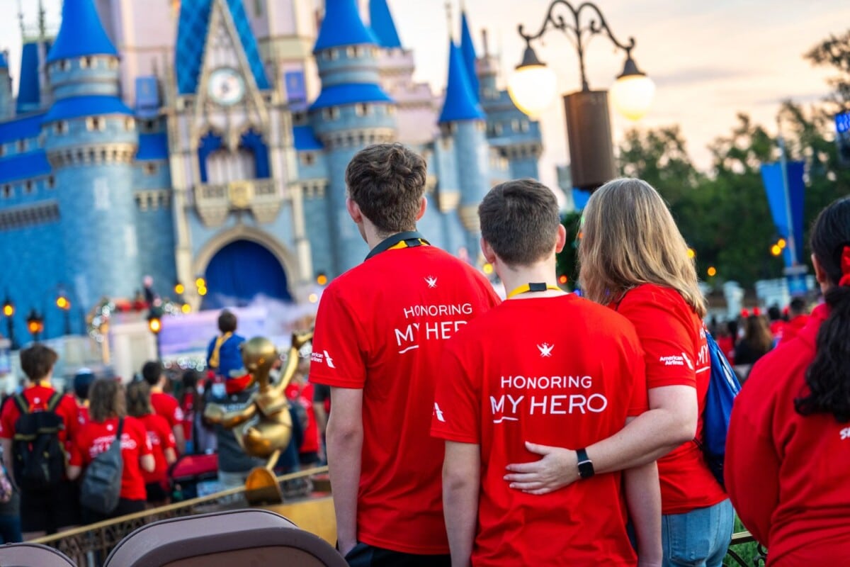 Families stand in front of Cinderella Castle