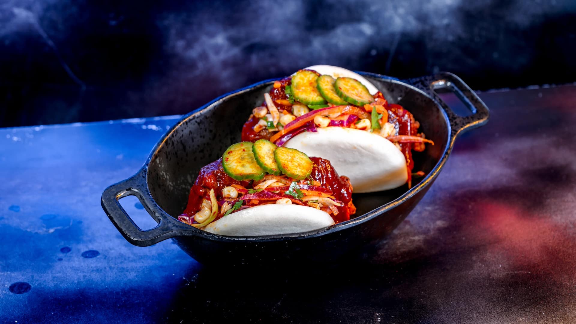 • Fried Chicken Baos: Two crispy chicken baos, sweet chili sauce, scallion salad, and cucumber coins