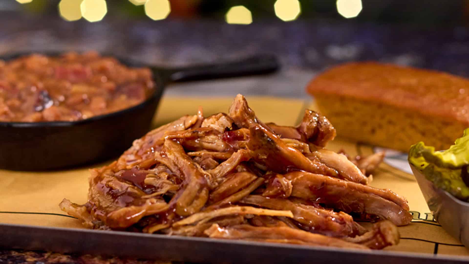 Platter with Mango Bread & Pickles - Banana Leaf Smoked Pulled Pork at The Oak & Star Tavern in Universal Epic Universe