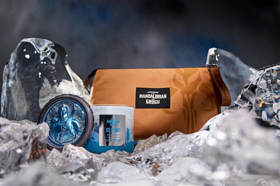 IMG1371 | The Main Street Mouse Mandalorian themed brown bag with Grogu emblem resting in icy surroundings with a blue Star Wars candle nearby