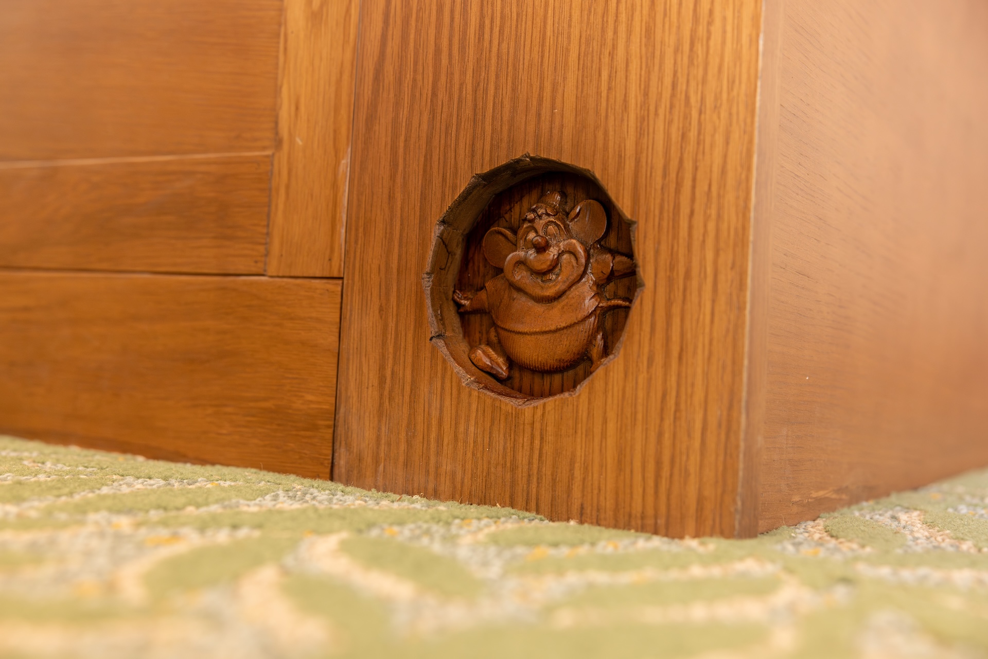 2026DVCReimaginedTreehouseVillas3 | The Main Street Mouse Wooden Furniture Leg with a Circular Hole Showing a Carved Frog Figurine Peeking out