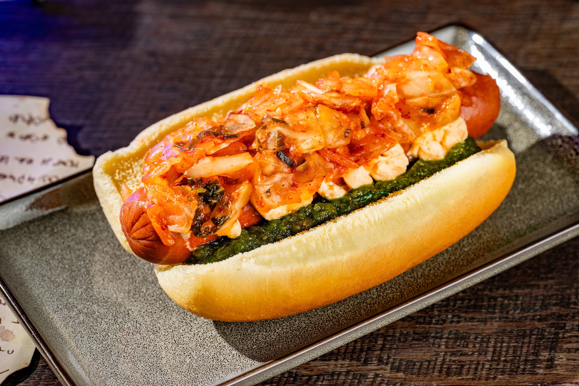 2026WDWMNSSHPFoodieGuideKimchiHotDog | The Main Street Mouse 2026 wdw mnsshp foodie guide kimchihotdog