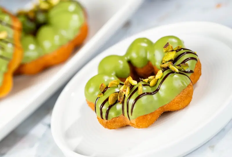 Connections Café Festival Menu PistachioChocolate Mochi Doughnut | The Main Street Mouse Connections Café Festival Menu Pistachio chocolate Mochi Doughnut