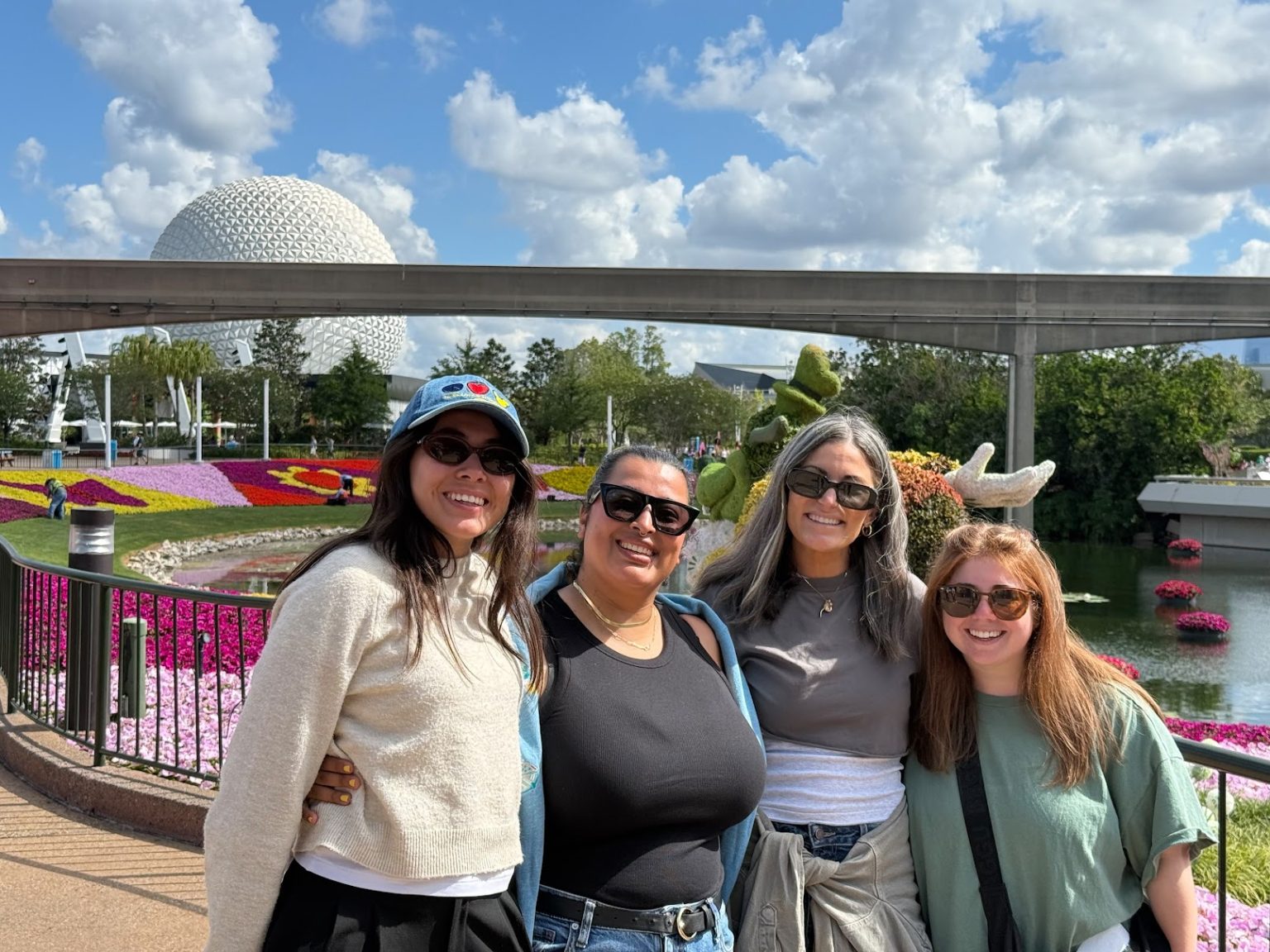 the Crew Behind the Sounds of Disney Advertisement Including Figueroa sierra Garcia Mirlis and Executive Producer Paige Bonanno Pose at Epcot at Walt Disney World Resort