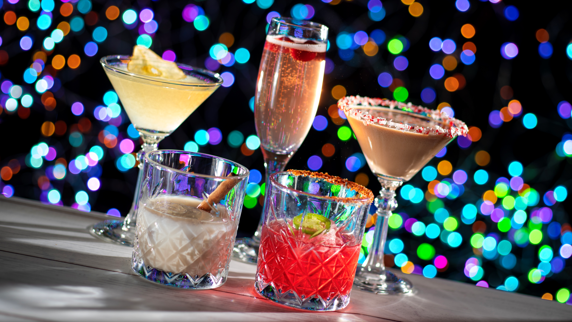 The Bauble and Bright cocktail in a souvenir cup at TuneIn Lounge for Disney Jollywood Nights | The Main Street Mouse the Bauble and Bright Cocktail in a Souvenir Cup at Tune in Lounge for Disney Jollywood Nights