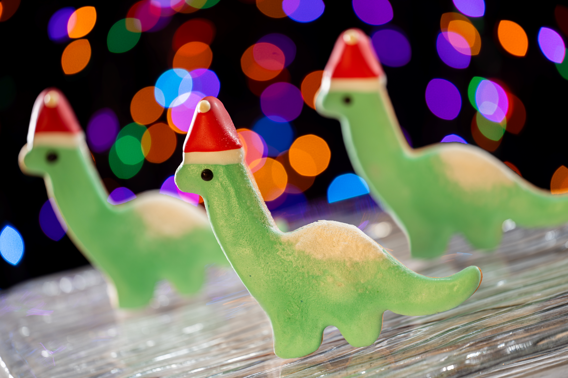 Christmas Gertie Cookie with a Santa hat at Dinosaur Gerties Ice Cream of Extinction | The Main Street Mouse Christmas Gertie Cookie with a Santa Hat at Dinosaur Gerties Ice Cream of Extinction