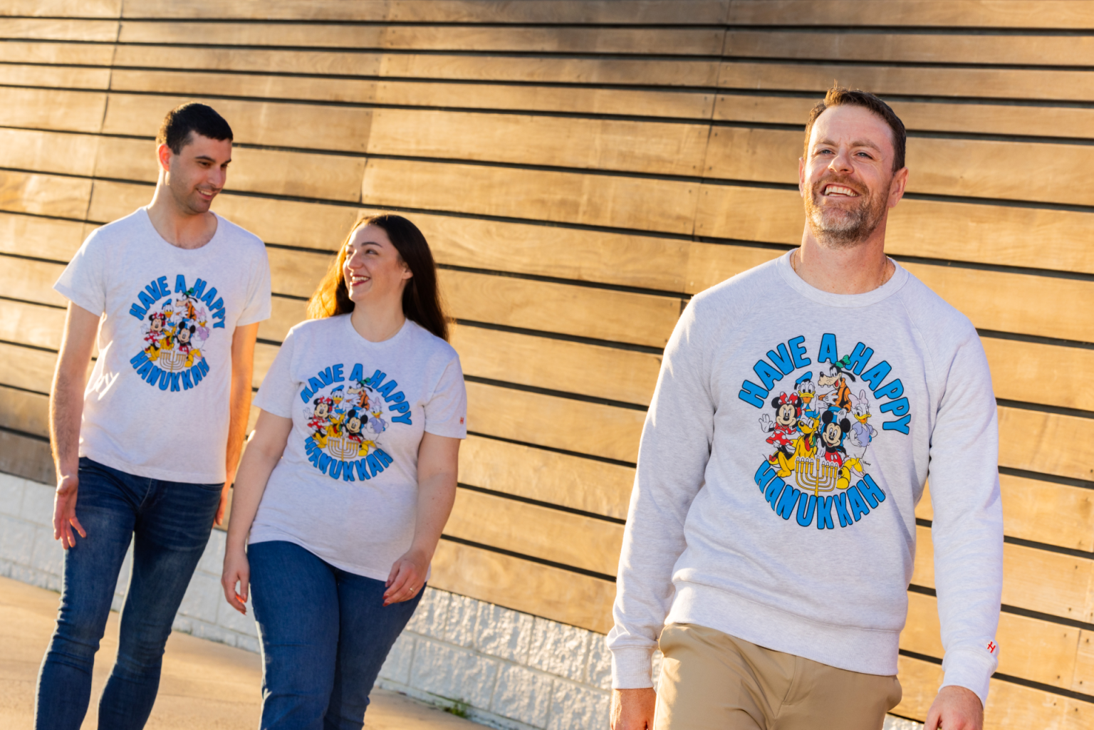 Mickey and Friends Gathered Around a Menorah on the New Disney Hanukkah Tee from Homage