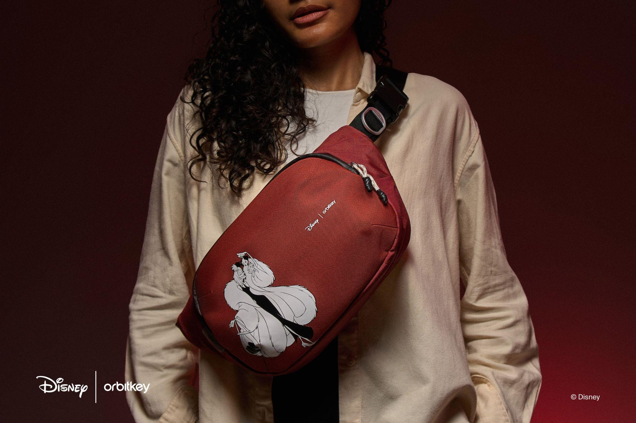 Orbitkey Disney Villains Cruella Urban Sling in Crimson Red with Cruella and a Dalmatian