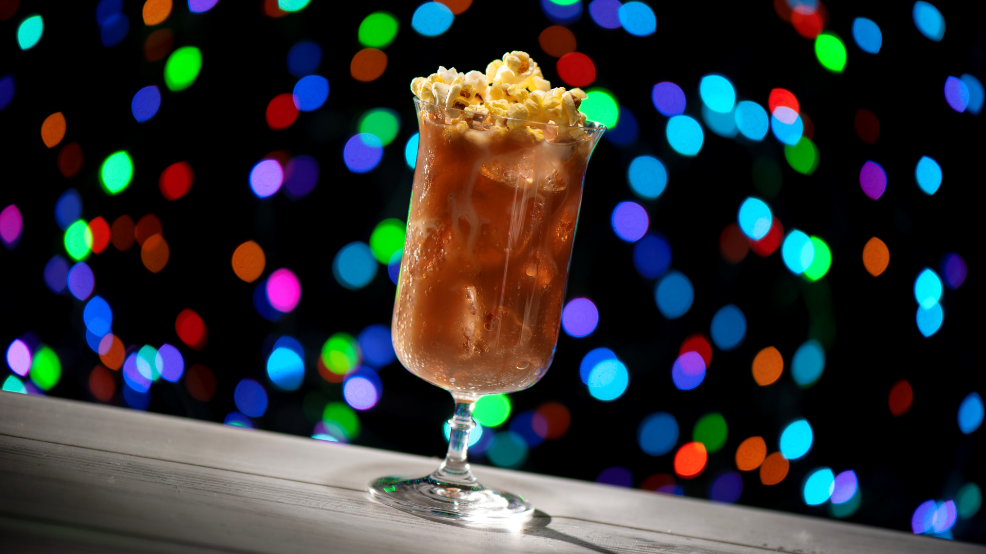 Popcorn Crafted Soda topped with fresh popcorn at Ice Cold Hydraulics for Jollywood Nights 2026 | The Main Street Mouse Popcorn Crafted Soda Topped with Fresh Popcorn at Ice Cold Hydraulics for Jollywood Nights 2026